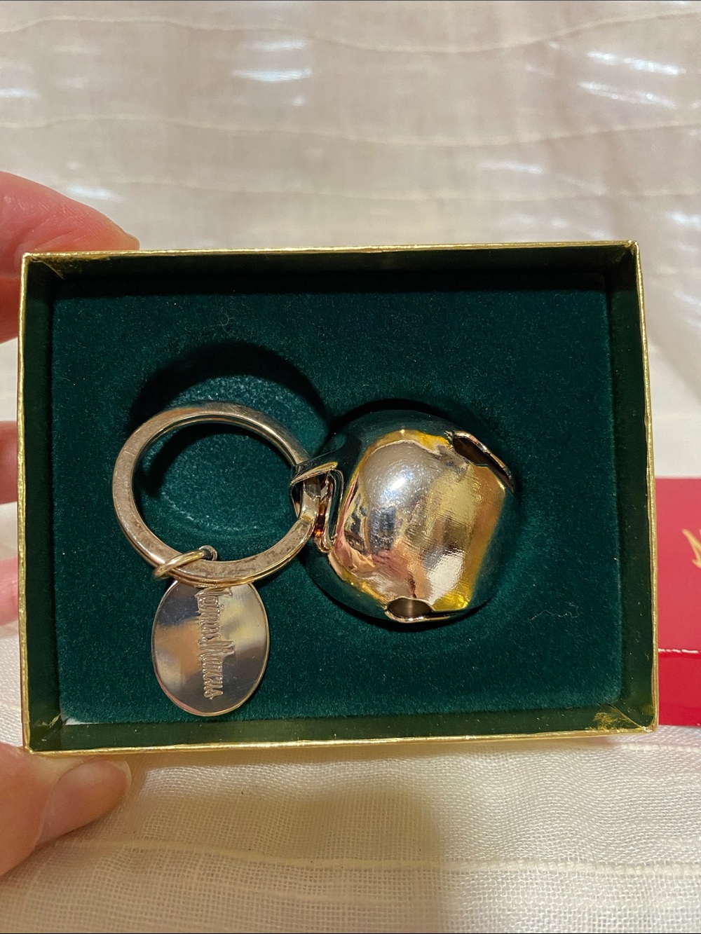 Neiman Marcus silver metal jingle bell keychain